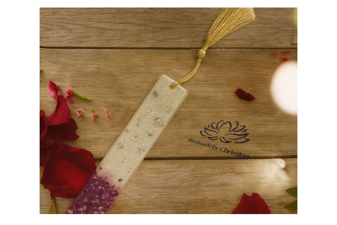 Bookmark with decorative elements on a wooden surface, featuring 'Handmade by Christine' branding.