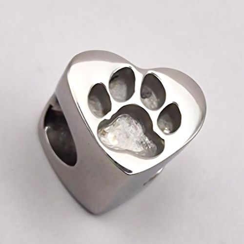 Silver ring with paw print design on a white background