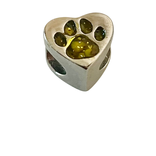 Heart-shaped silver charm with embedded green stones on a white background
